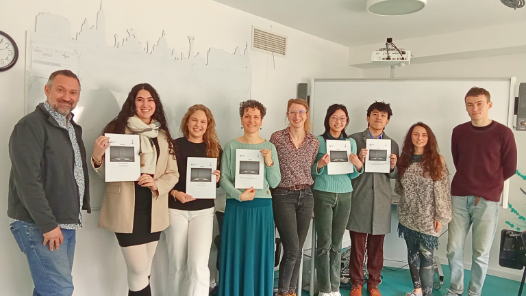 Adult learners and teachers hold certificates after completing a CELTA course in Budapest.